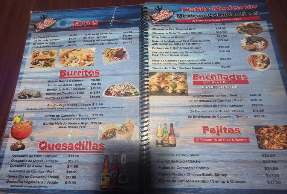 Printed menu showing tacos and quesadillas.